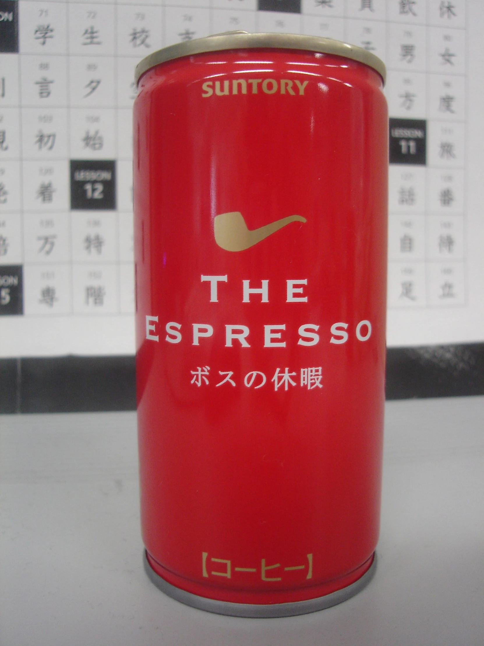 a can of suntoryy the espresso is on a table