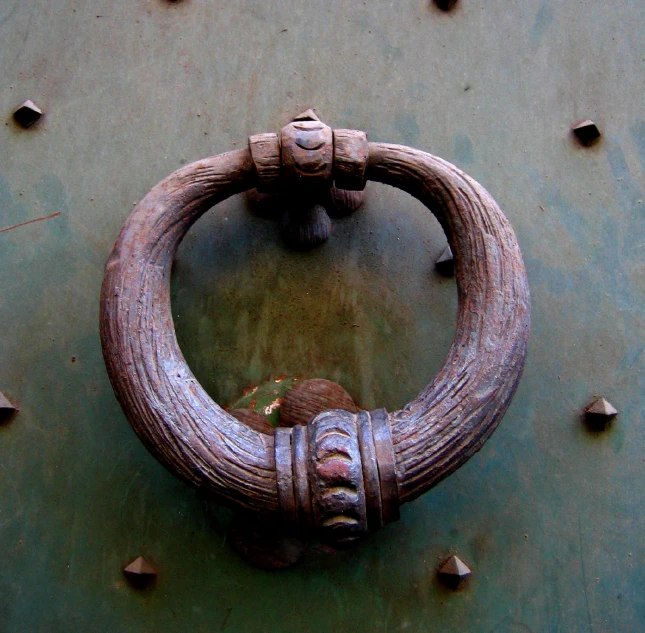 close up of old style ss door knockle