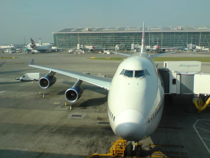 a jetliner sitting on top of an airport tarmac