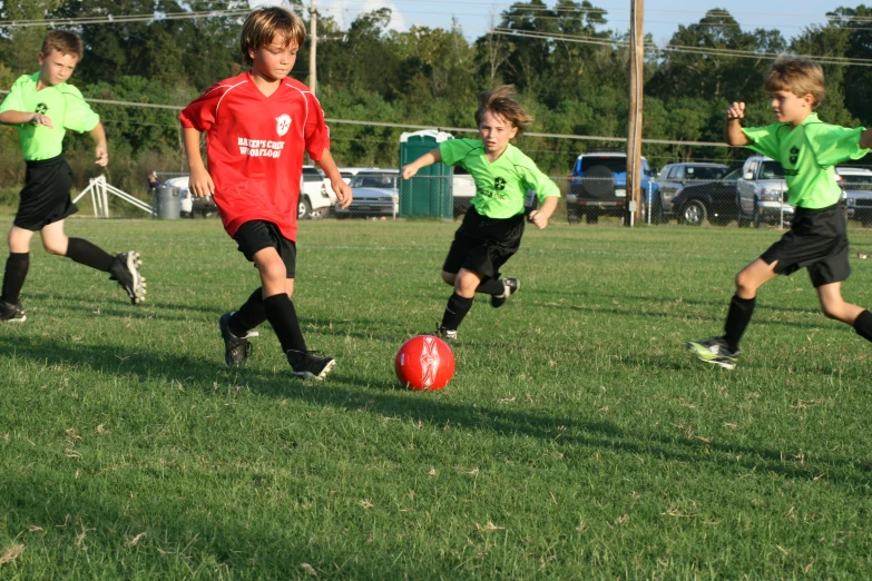 the s are playing soccer in their uniforms