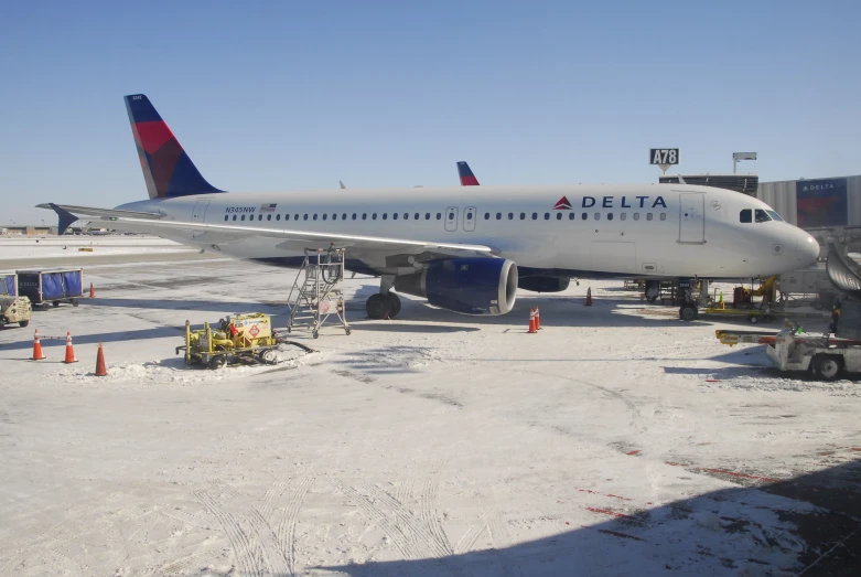 a delta airlines airplane is parked on the runway