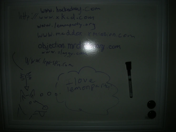 writing on a white board in the dark