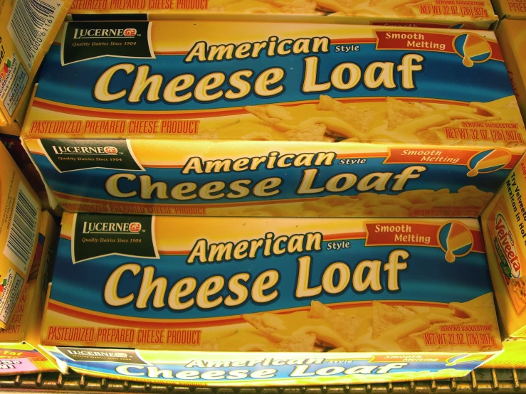 four boxes of american cheese loaf cheeses