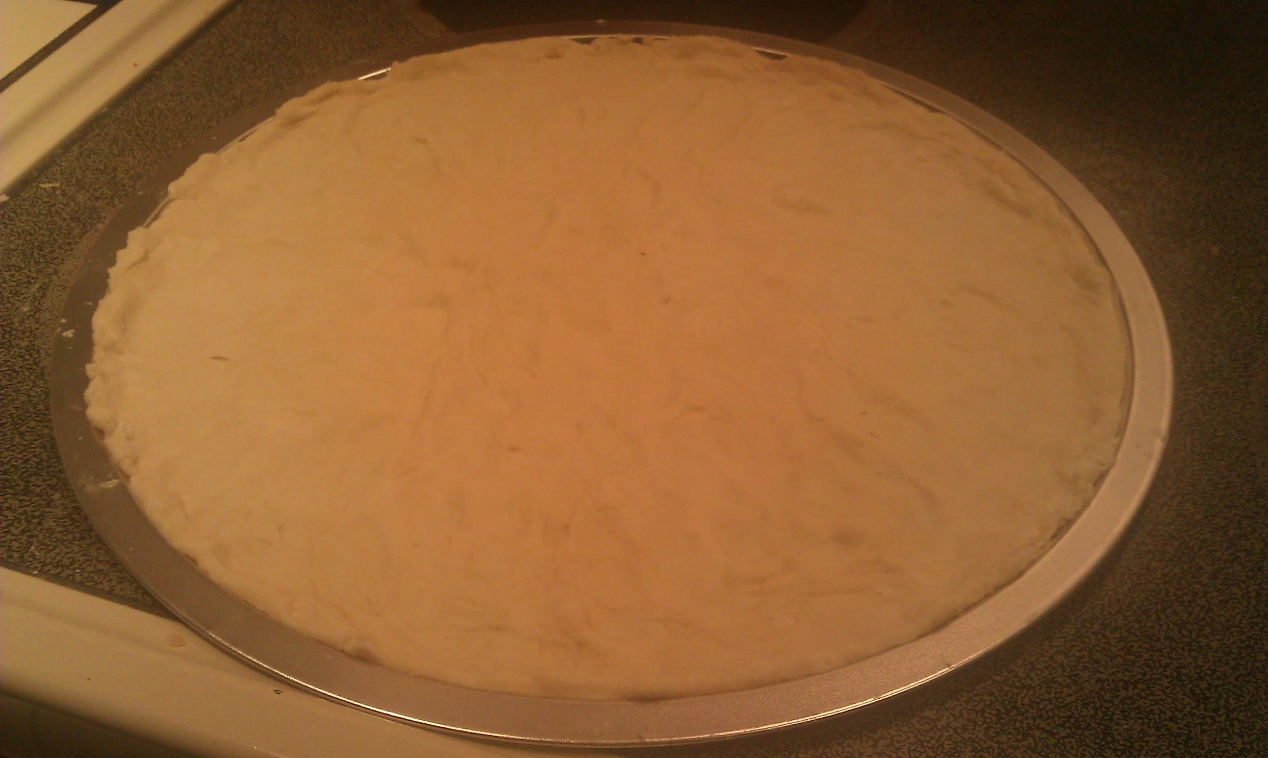 there is a pan with a lot of dough on top