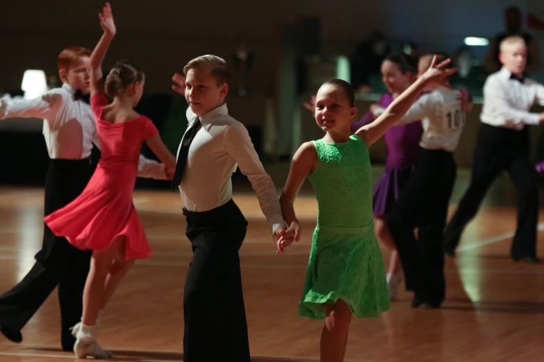 a group of children dancing in dance lessons