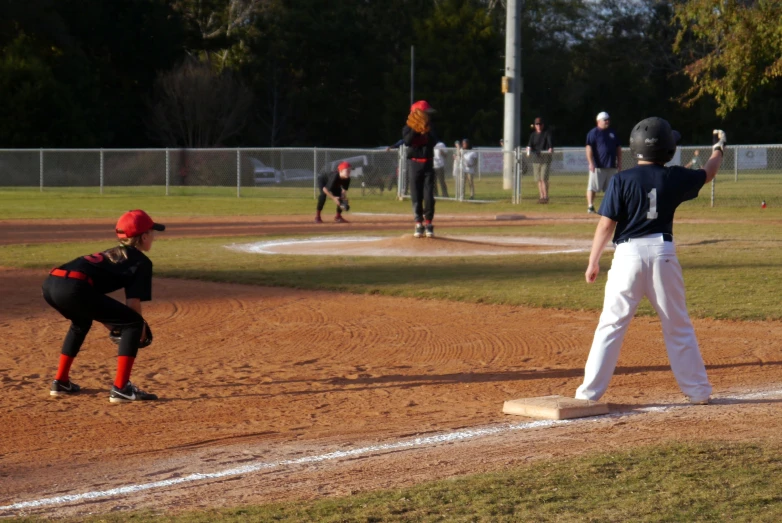 a man is preparing to swing at a pitch during a baseball game