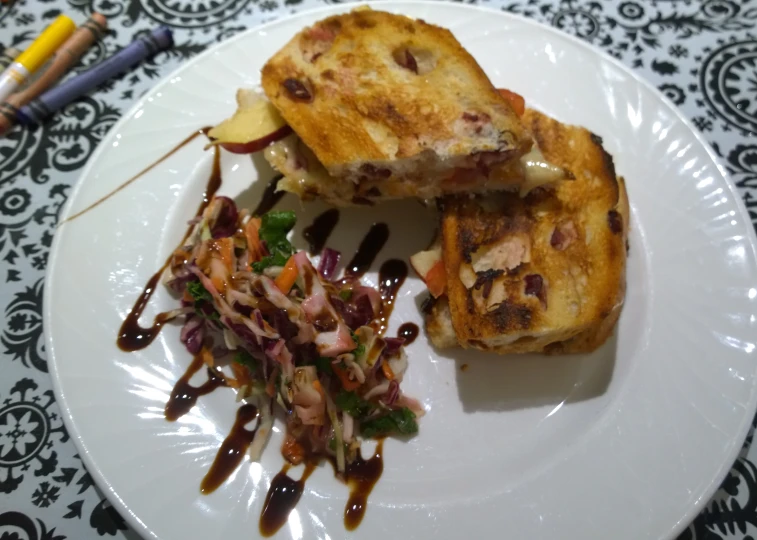 two pieces of toast and some vegetables on a plate