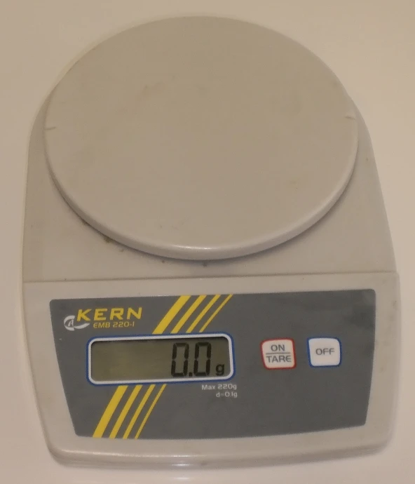 the digital kitchen scale has a large clock