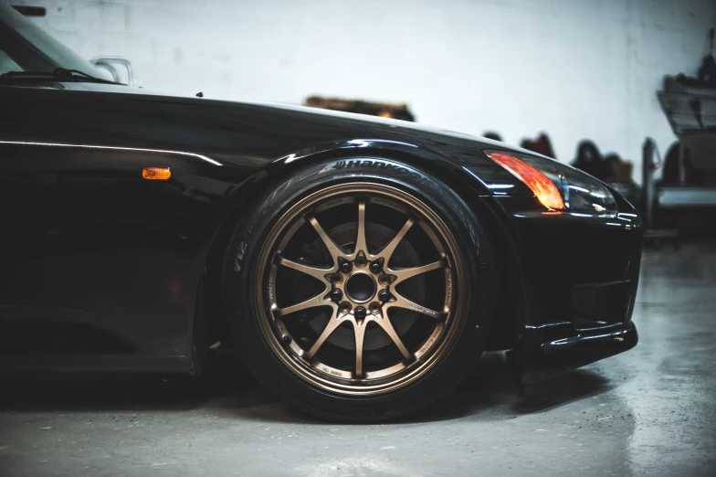 a sports car with chrome rims on display