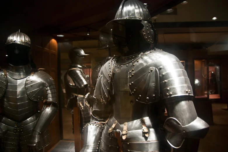 two knights wearing full metal armor standing next to each other