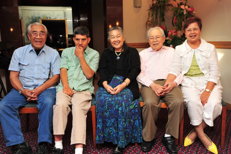 a group of older adults sitting and smiling