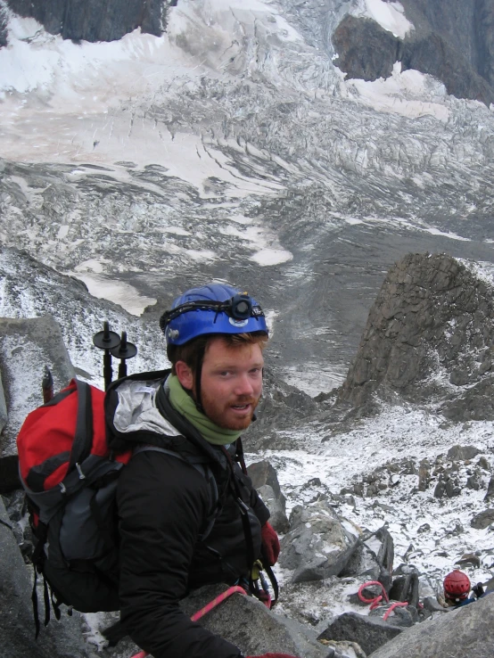 a man with a backpack is on a hill