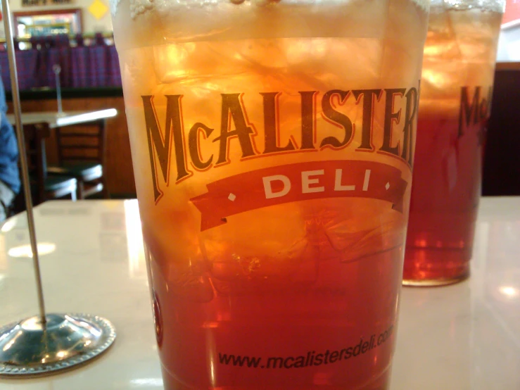 a large glass full of ice with the word mcallaste