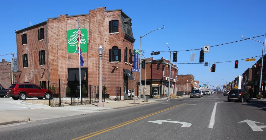 an old brick building with a green tree decal