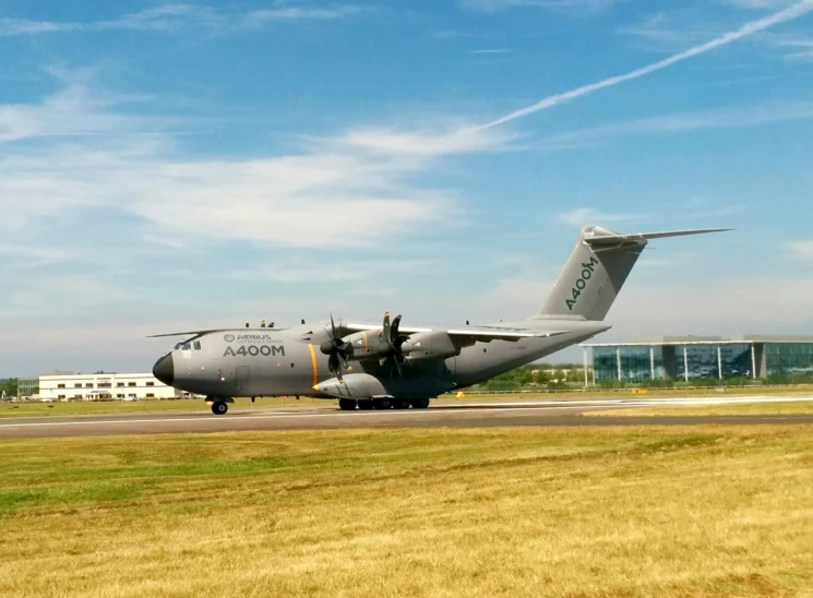 a large military aircraft sitting on a runway