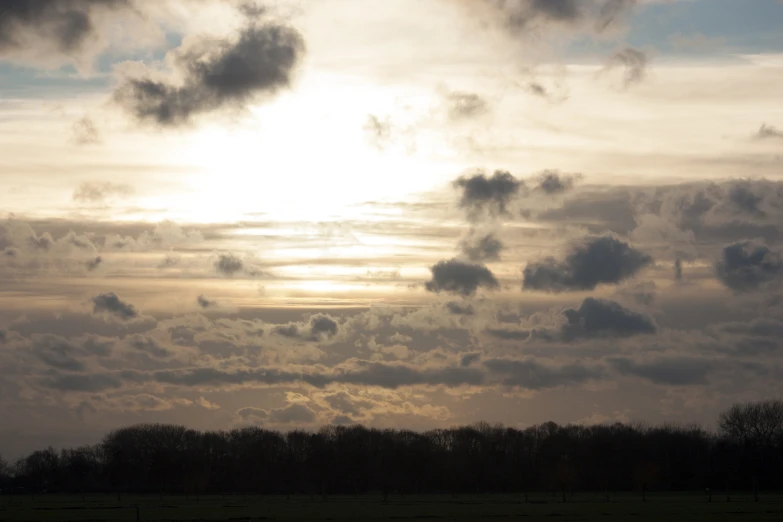 an overcast day is seen above a field