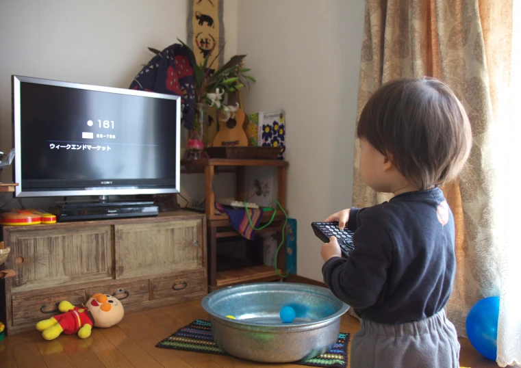 a  is watching television in the living room