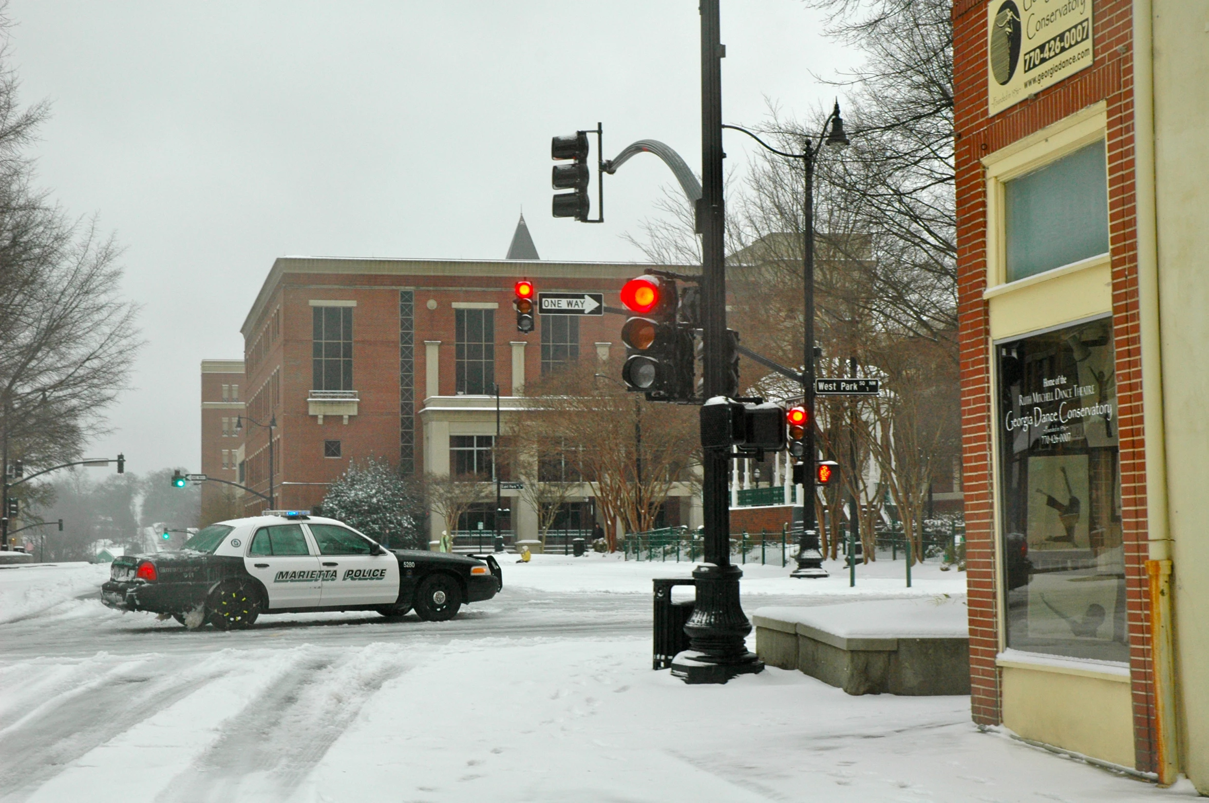 traffic on a snowy day at an intersection