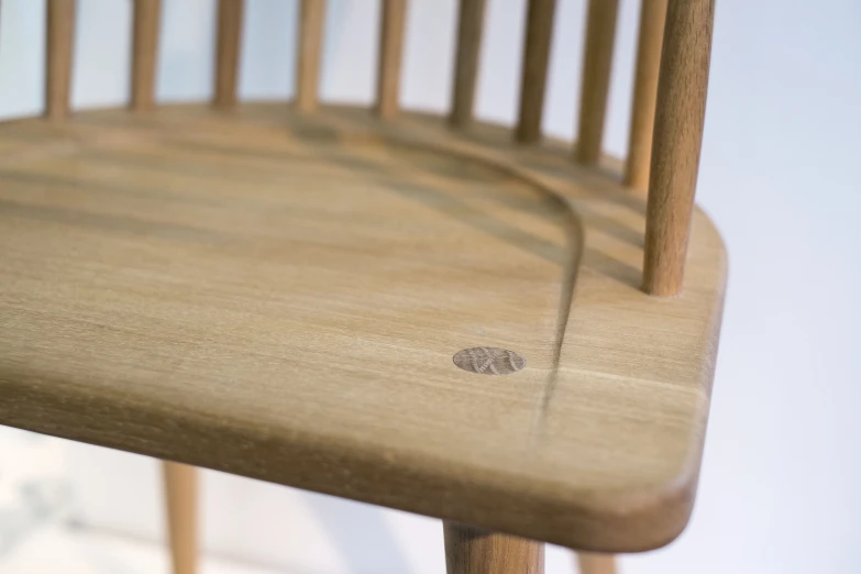 a wood chair sitting next to a wooden table