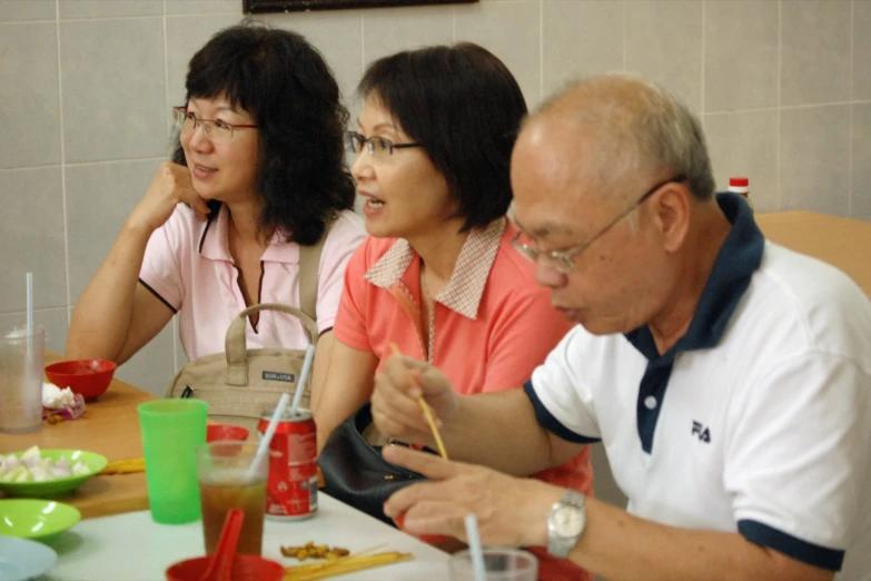 a group of people that are sitting down together