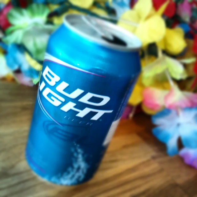 a can of bud soft sits on a table