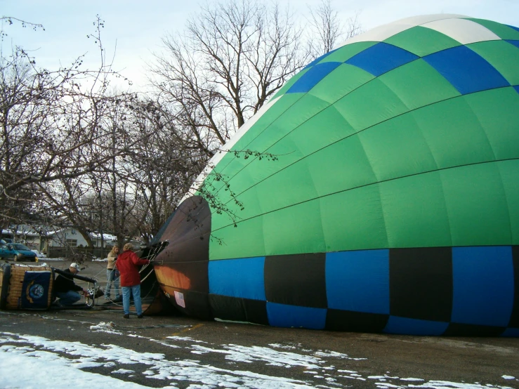 a large balloon being worked on by an employee