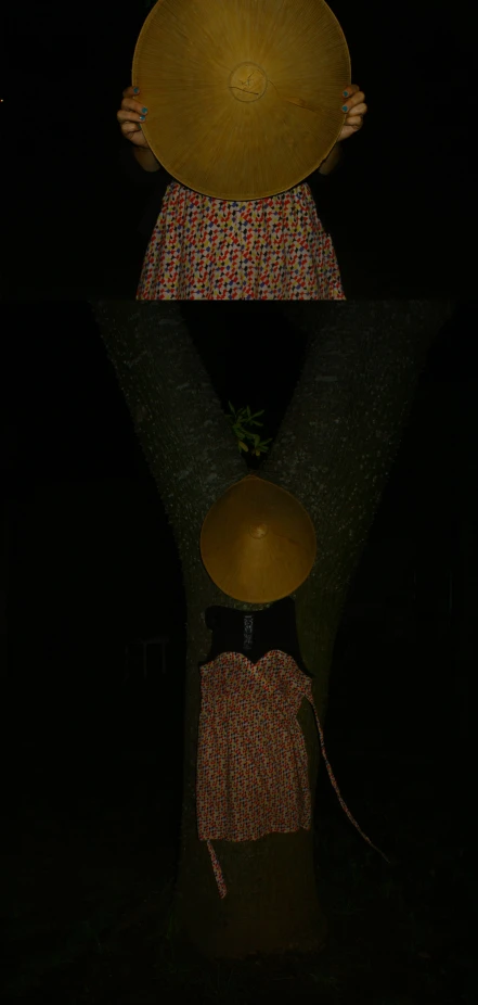 a woman with an umbrella over her head at night