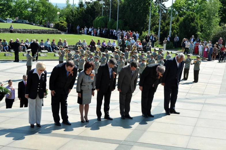 a group of people with their heads close together