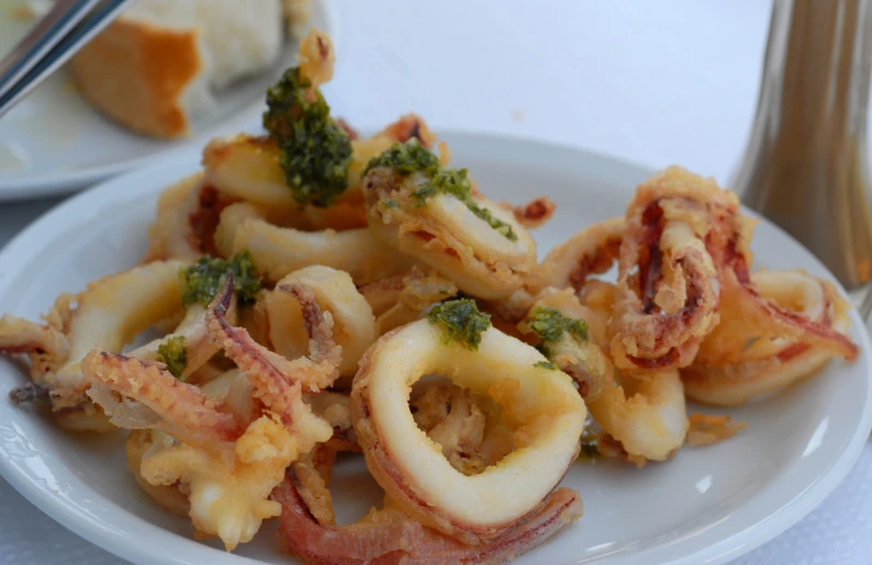 a plate filled with cooked vegetables and rings