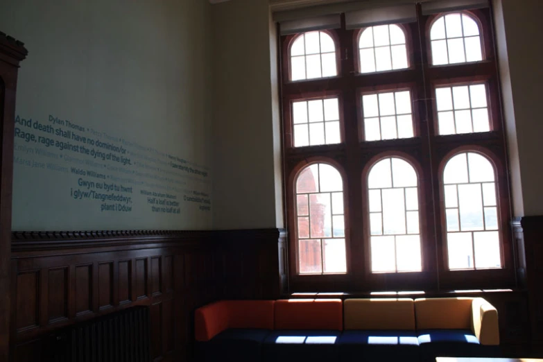 a building with arched windows and wood paneling