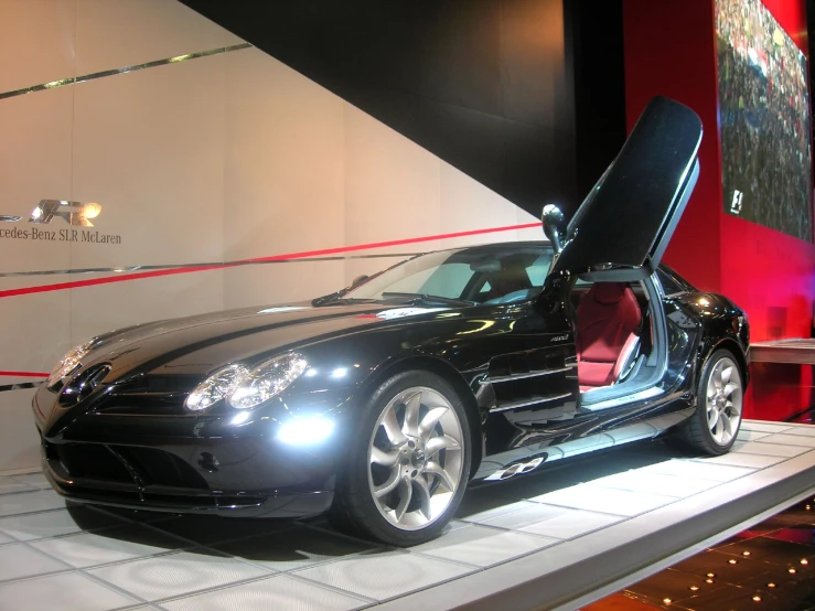 a close up of a mercedes slk parked on display