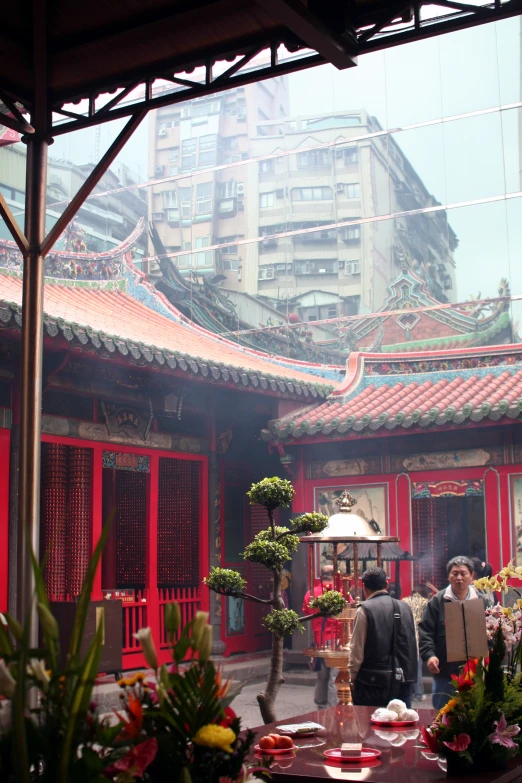 the restaurant is brightly decorated with red and black oriental decor