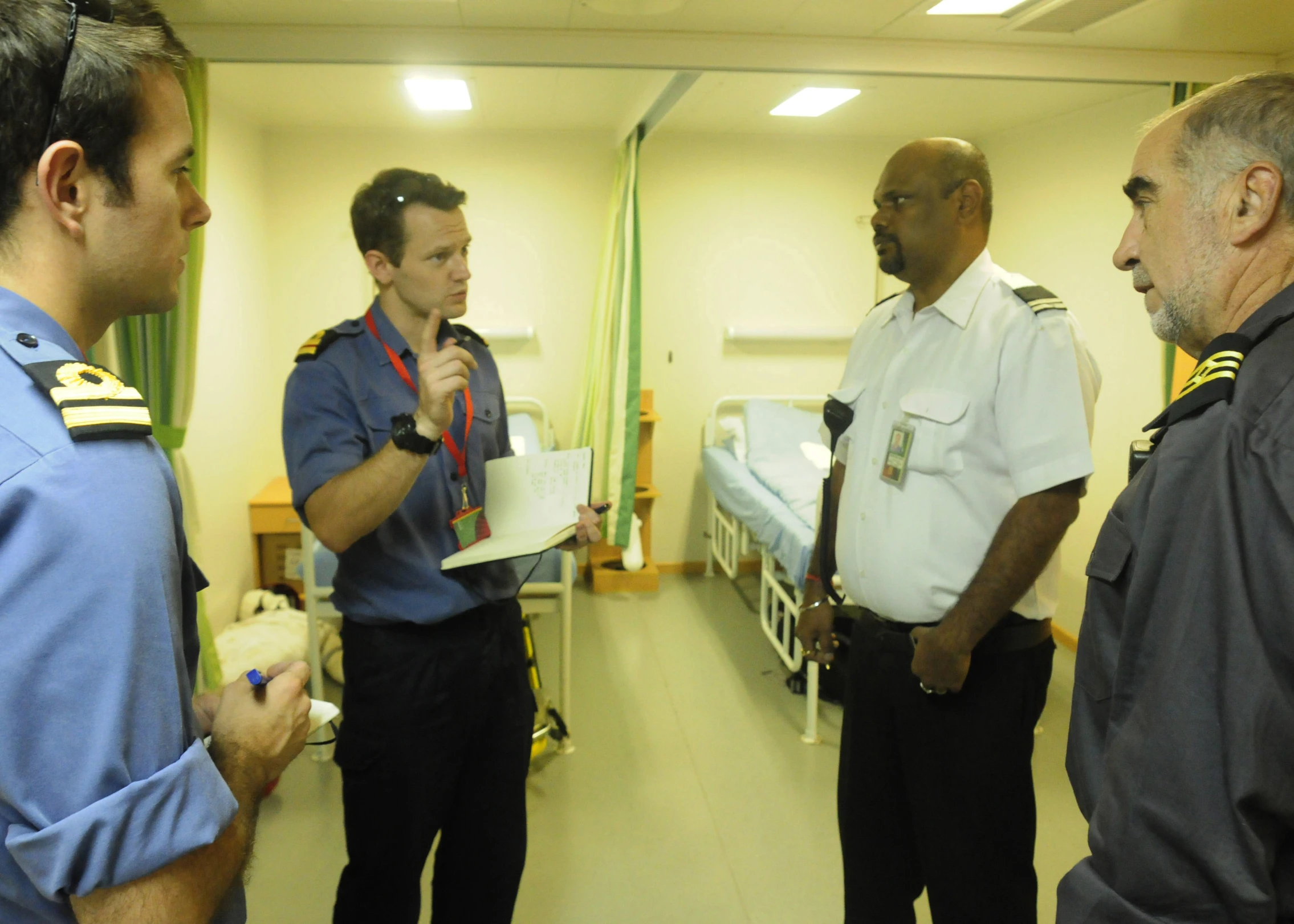 a couple of men in uniforms standing around