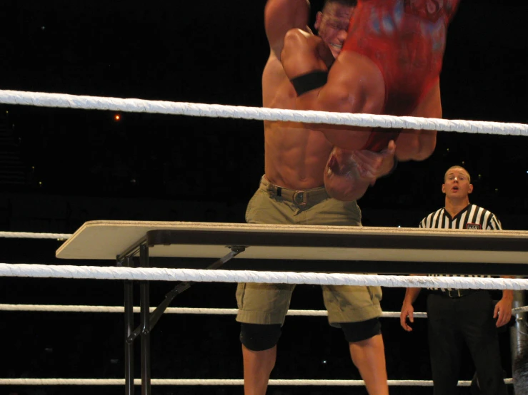 a wrestlers wrestling in an empty ring