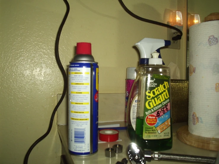 a counter topped with items next to wall paper