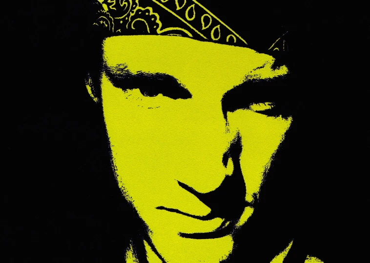 a man wearing a yellow crown over his head