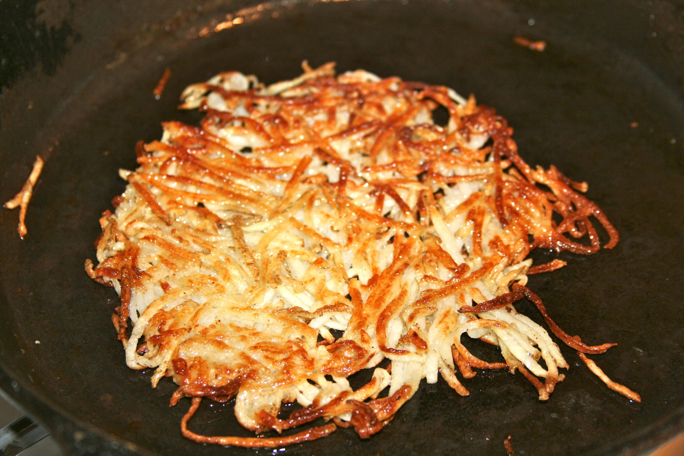 a dish is being cooked in a pan