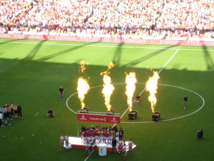 flames are shown on the field during a soccer game