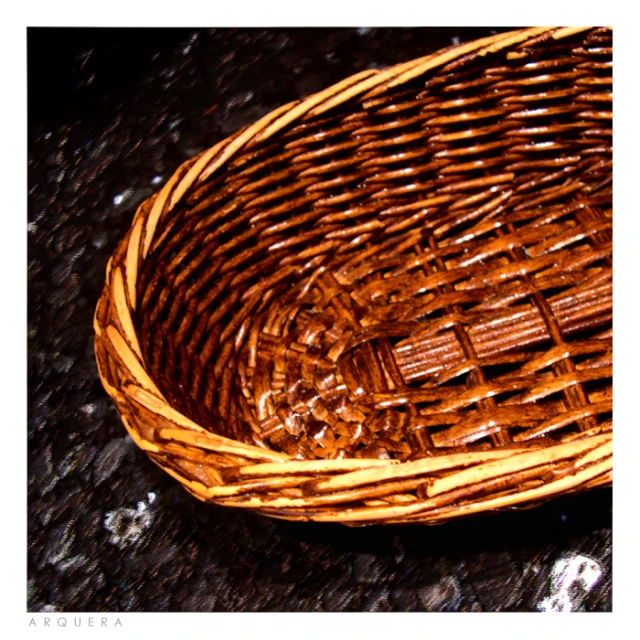 a wicker basket is sitting on the ground