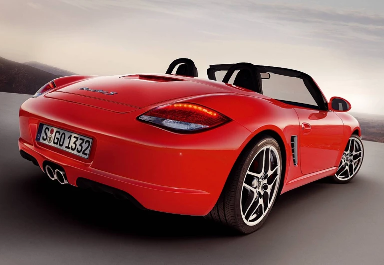 a bright red sports car in the desert