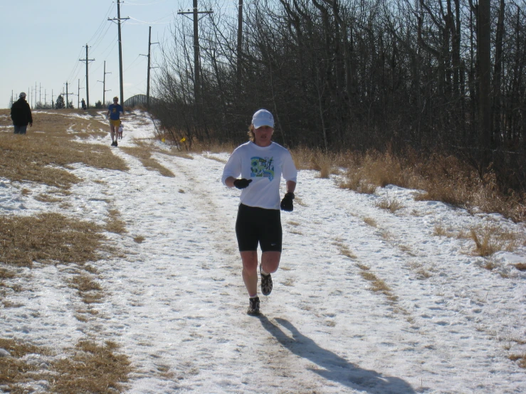 people that are jogging in the snow together