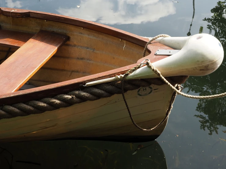 a close up of a small boat in a body of water