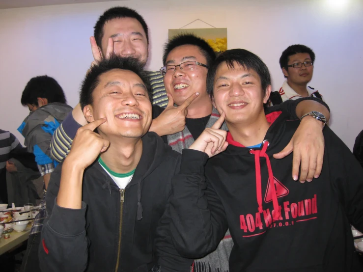 a group of young people are smiling together