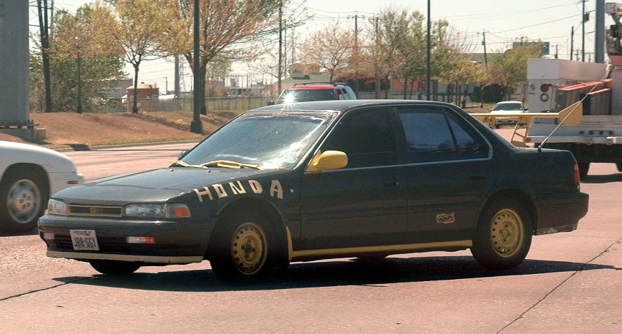 an officer stands near a car on the street