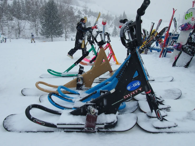 skiers standing by their snowboards in a snowstorm