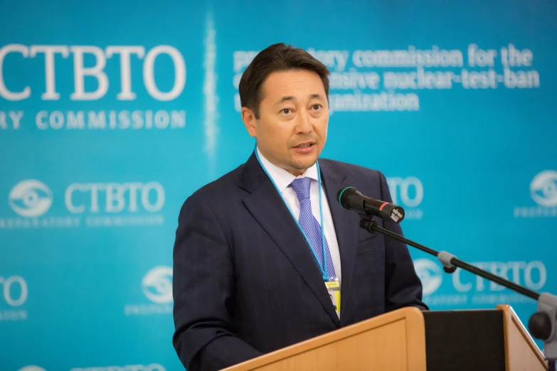 a man giving a speech at a podium