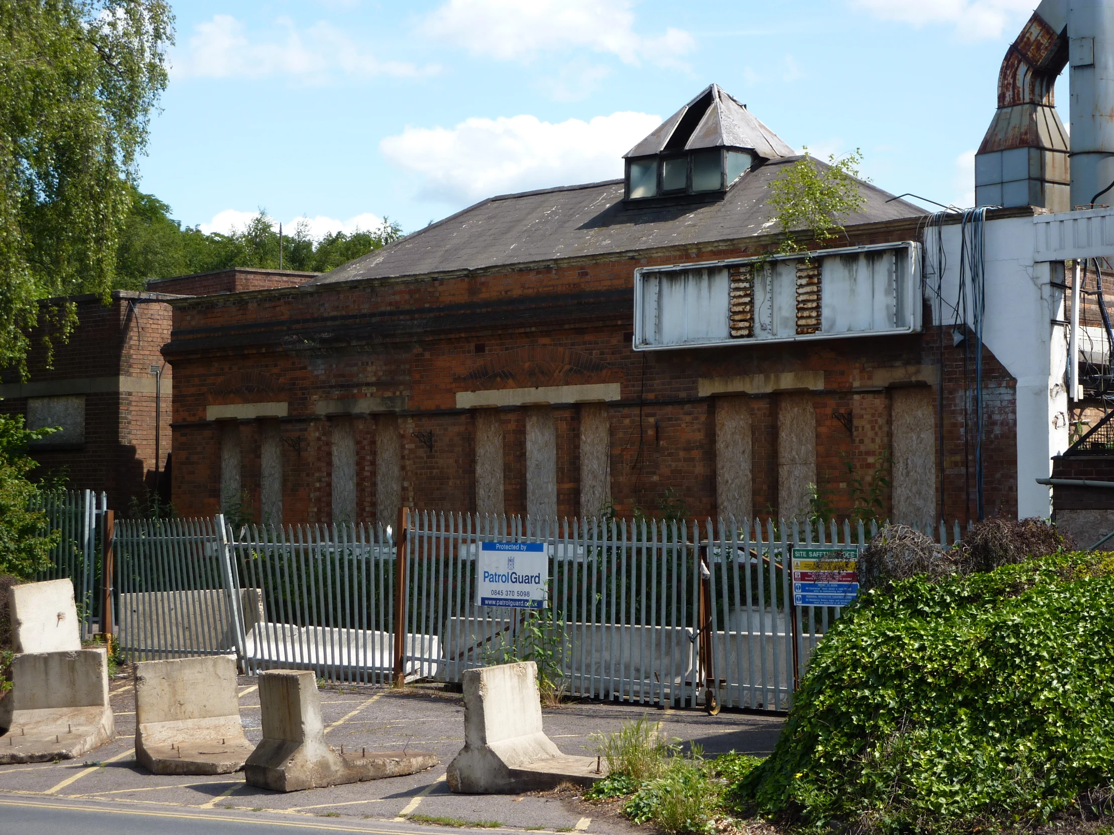 a large building with old windows and lots of cement blocks