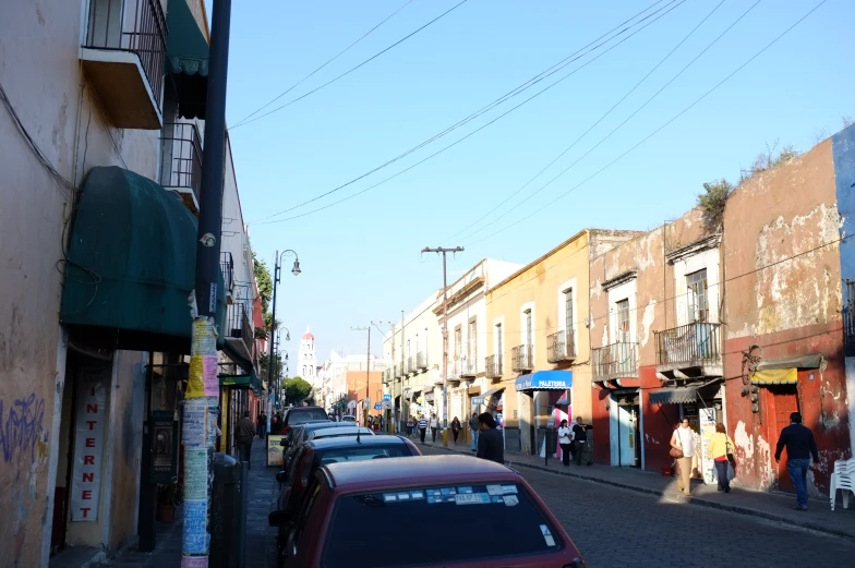 a bunch of cars are parked on the street