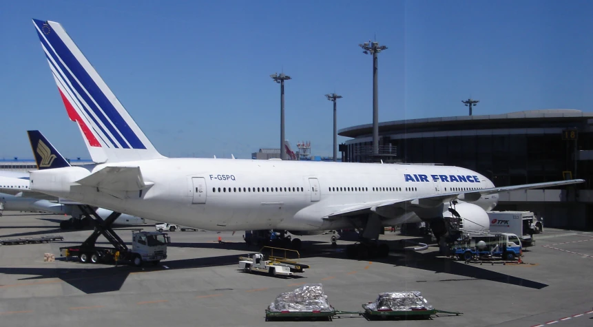 a large commercial airplane is parked at the airport