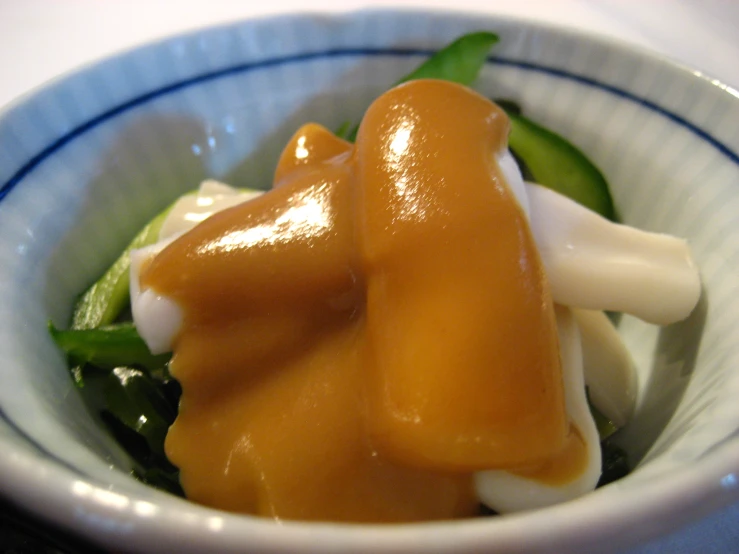 an asian dish contains green peppers and sauce